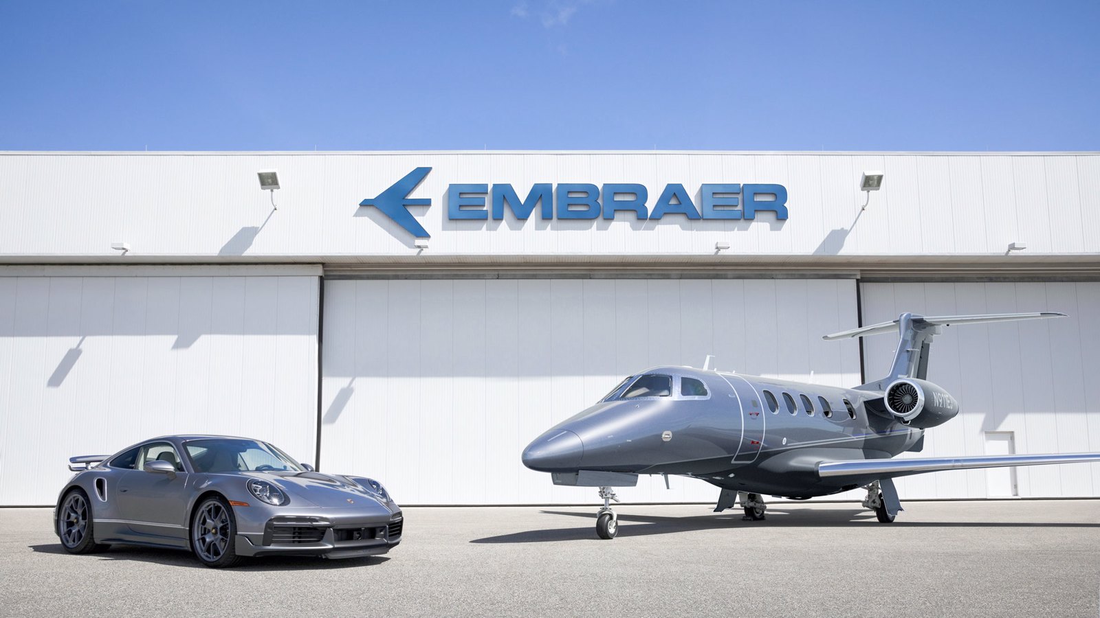 Special edition Embraer Phenom 300E business jet and customised Porsche 911 Turbo S.