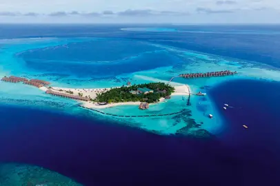 In the South Ari Atoll, the island in the blue heart of the Maldives