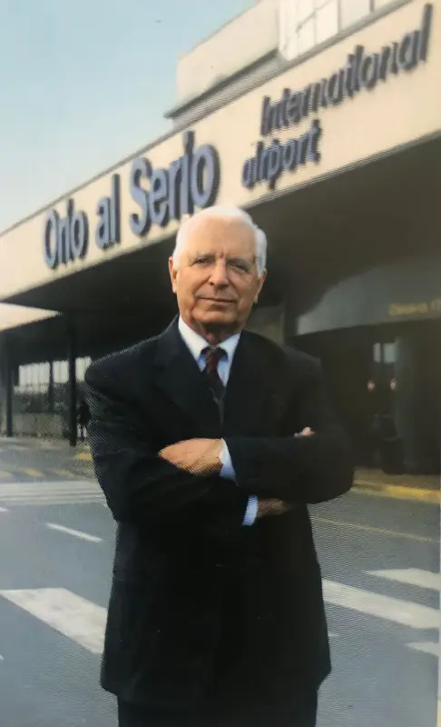 Ilario Testa, historic Sacbo President at the entrance to Orio al Serio airport.. Photo: Copyright © Avion Tourism Magazine.