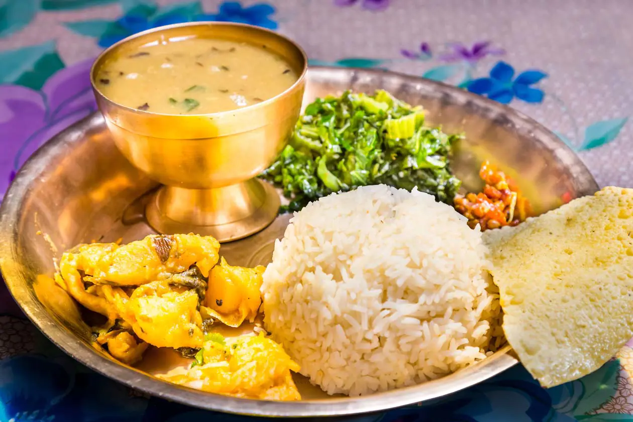 Daal Bhat, Pokhara, Nepal Copyright © Sisterscom.com / Depositphotos