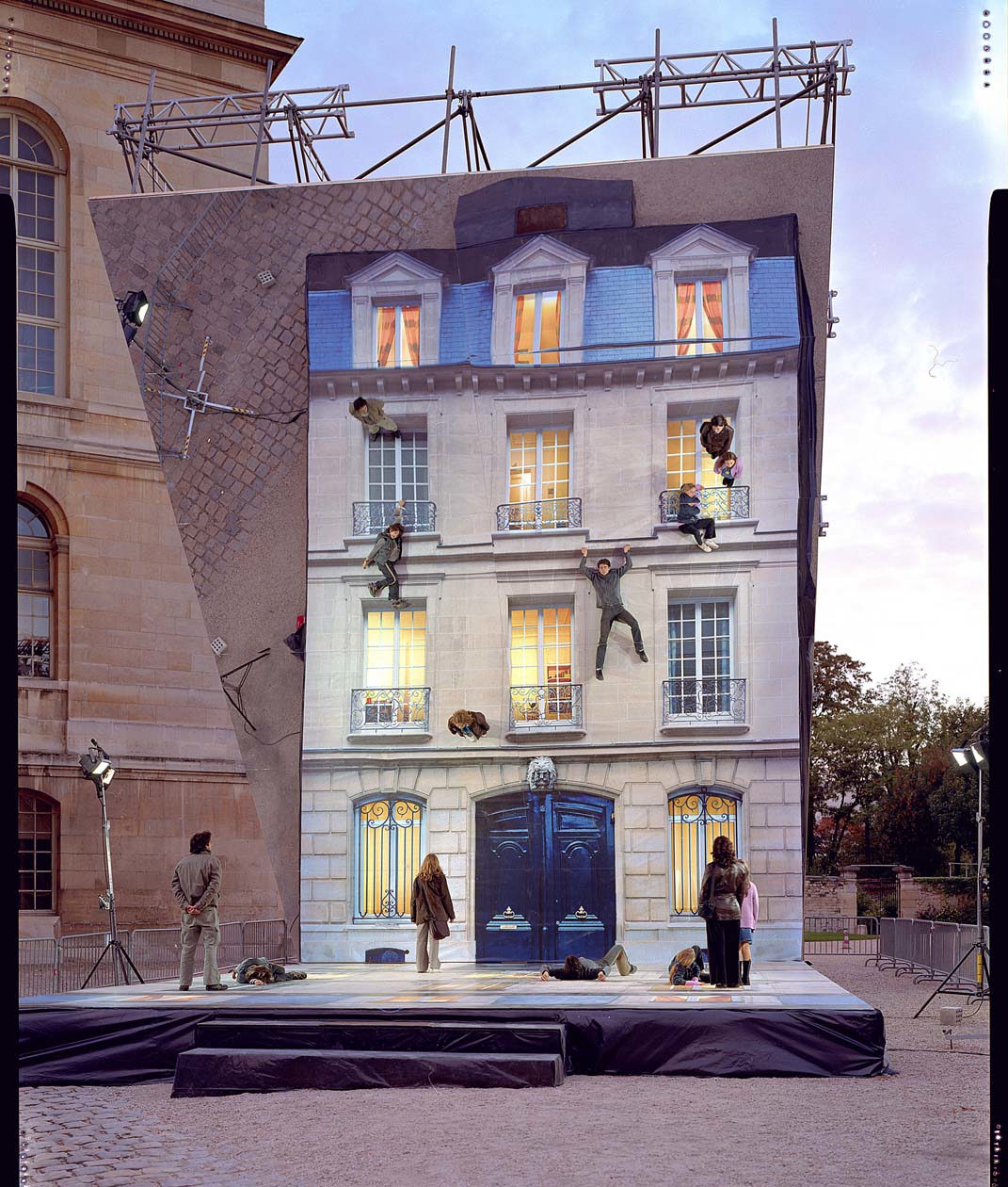 Leandro Erlich Bâtiment (2004) A building facade laid flat under a mirror suspended at a 45-degree angle Dimensions variable Fourteen different facades each specific to the city that hosted the temporary installation Nuit Blanche, Paris, France, 2004 Courtesy Galleria Continua