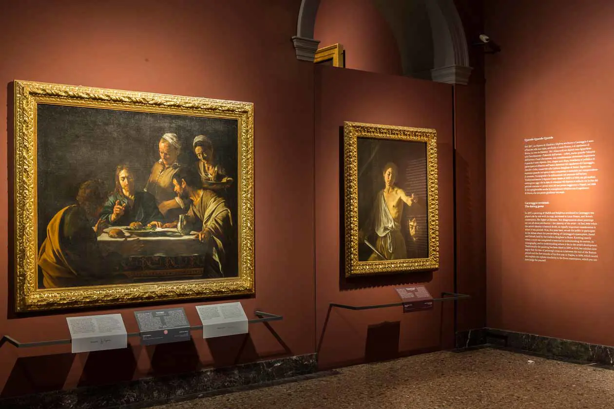 "Caravaggio", il IX dialogo della Pinacoteca di Brera. La Cena in Emmaus della Pinacoteca di Brera e il David con la testa di Golia della Galleria Borghese. Copyright © Milano, Pinacoteca di Brera.