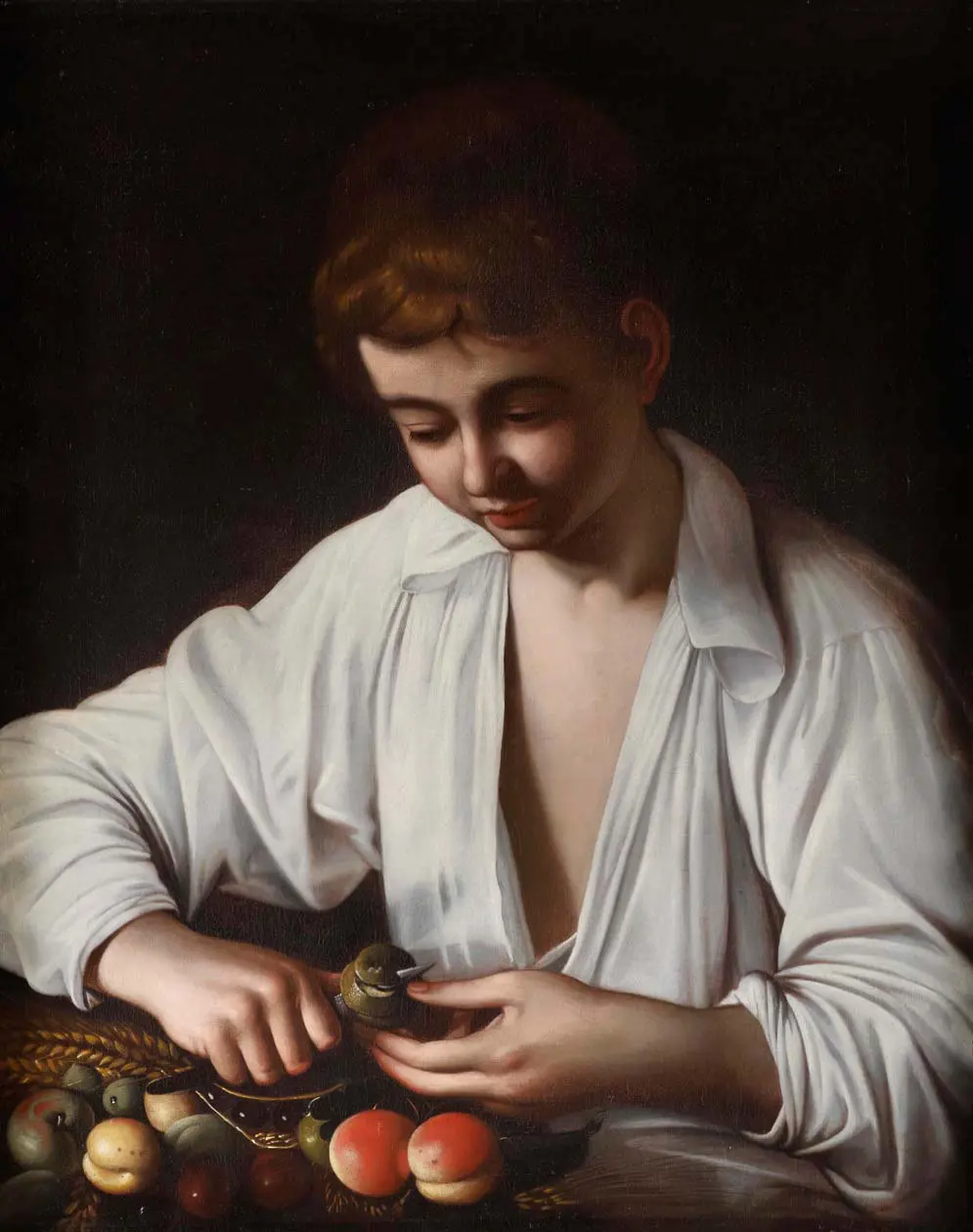 Michelangelo Merisi da Caravaggio, Ragazzo che monda un frutto (anche detto Mondafrutto), Fine del XVI secolo, Olio su tela, 64,2x51,4 cm. Londra, collezione privata Foto: Copyright ©&nbsp;Ufficio Stampa Arthemisia